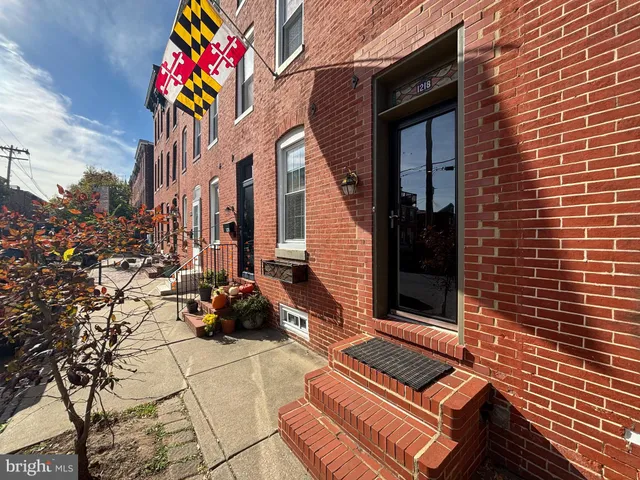 a front view of a house with a sitting area