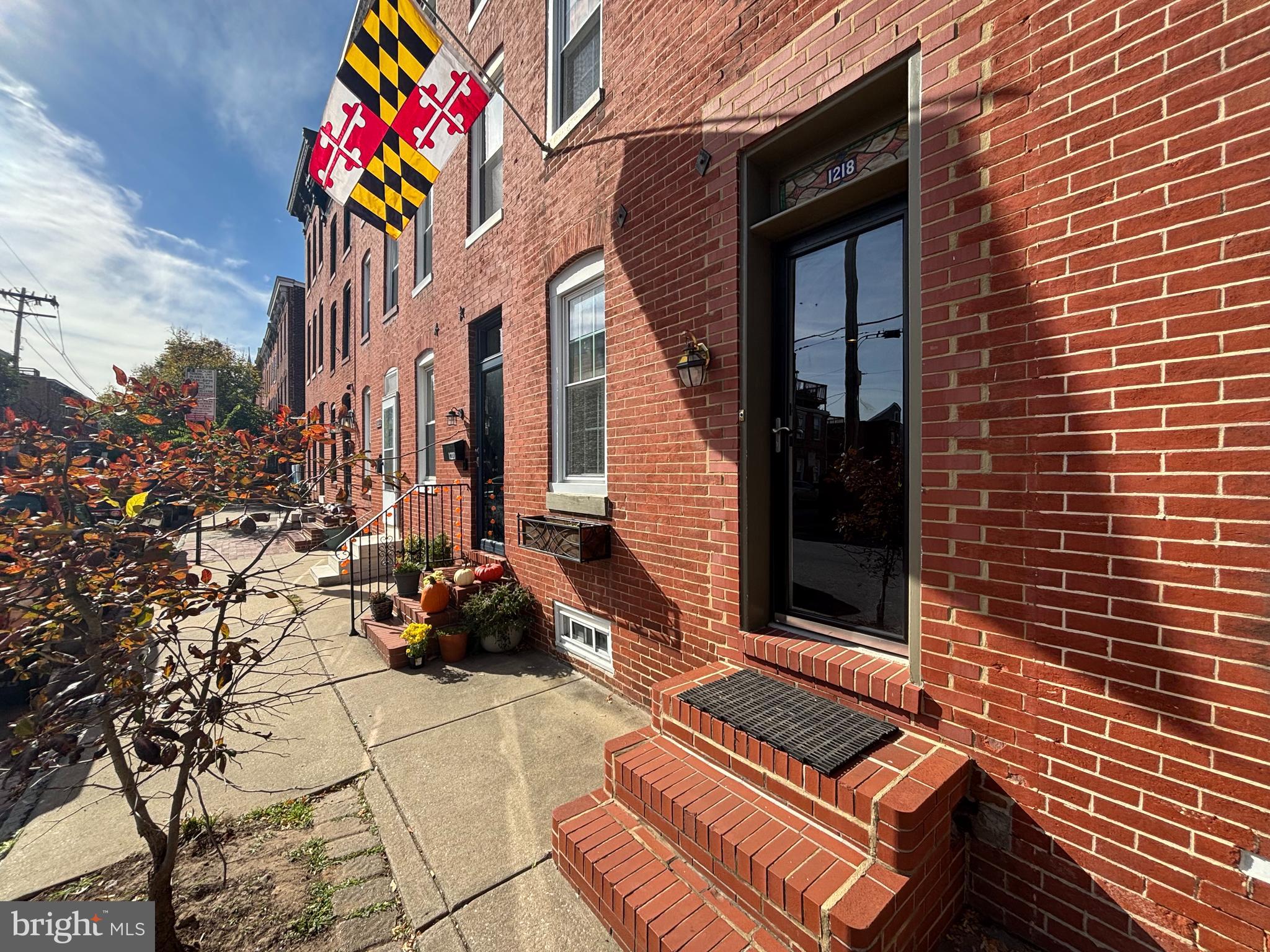 a front view of a house with a sitting area