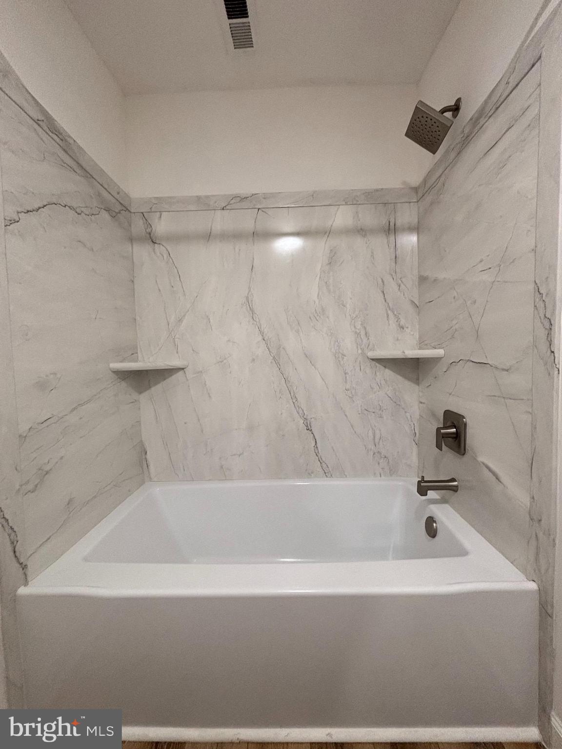 1218 Riverside Avenue Baltimore, MD 21230 - Photo 19 of 38 a bathroom with a bathtub and a shower