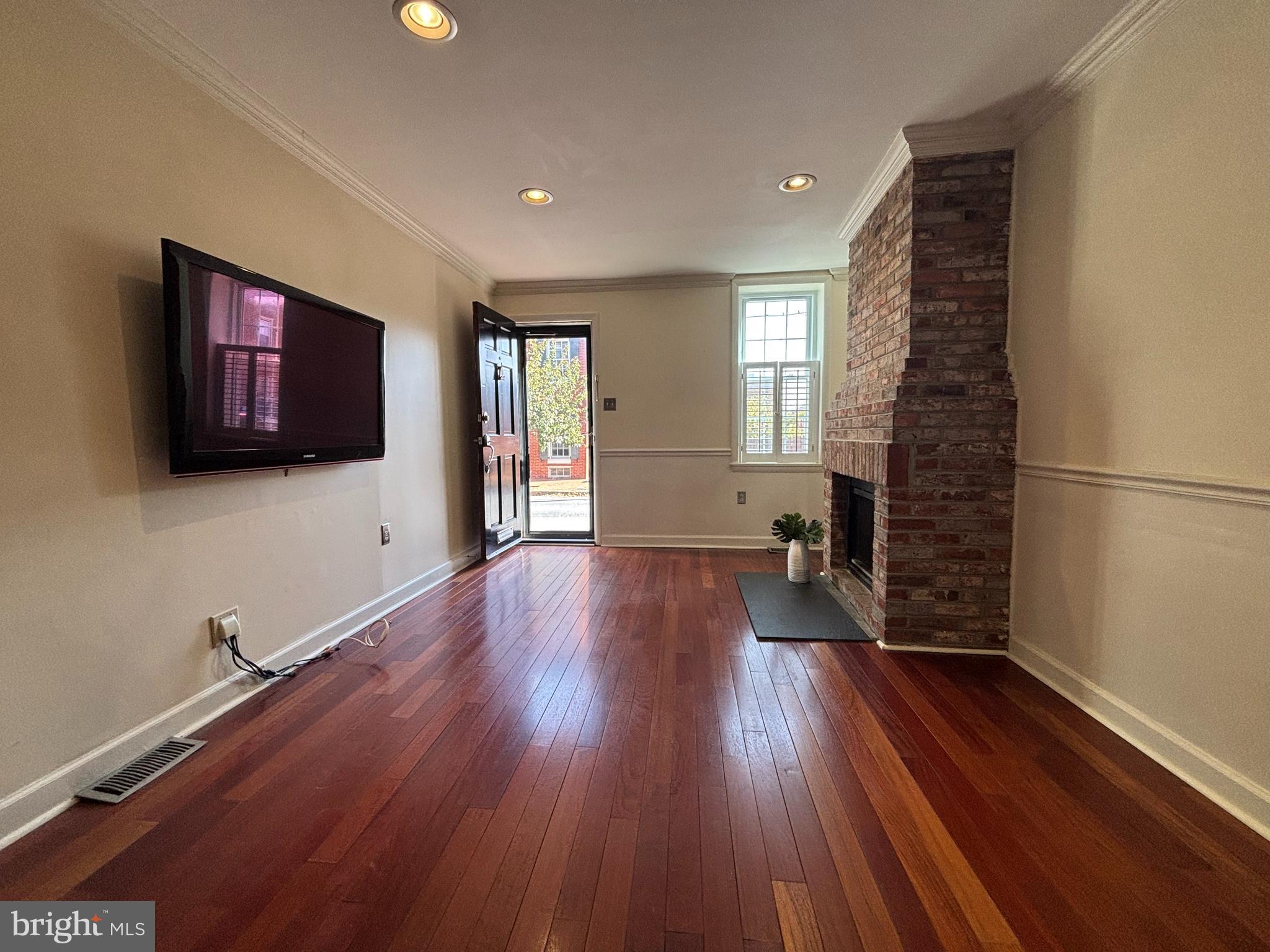 1218 Riverside Avenue Baltimore, MD 21230 - Photo 5 of 38 a view of a livingroom with wooden floor and window