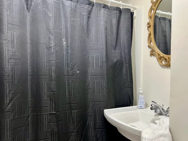 a bathroom with a sink and mirror