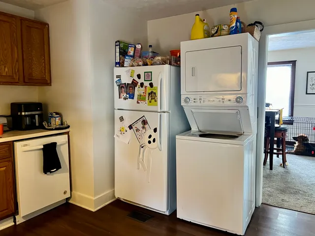 a living room with baby bed furniture and a window