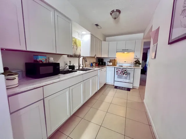 a bedroom with a bed and a lamp