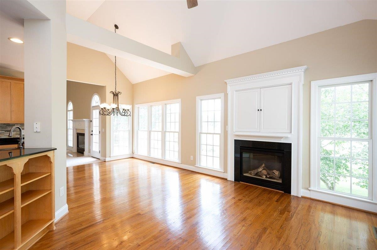 545 Competition Road Raleigh, NC 27603 - Photo 15 of 40 Formal living area next to the kitchen. Gas log fireplace and inset TV cabinet. Living Room