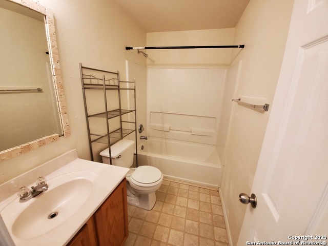 25714 Gold Yarrow San Antonio, TX 78260 - Photo 11 of 15 a bathroom with a sink toilet and shower