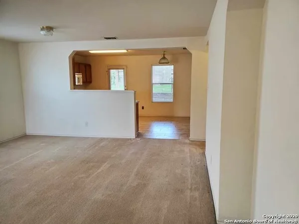 a kitchen with stainless steel appliances a stove top oven a sink dishwasher and a refrigerator