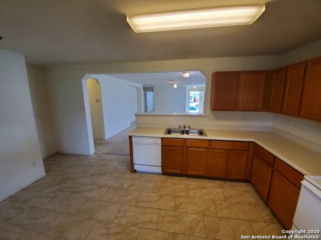 a bathroom with a sink a mirror and shower
