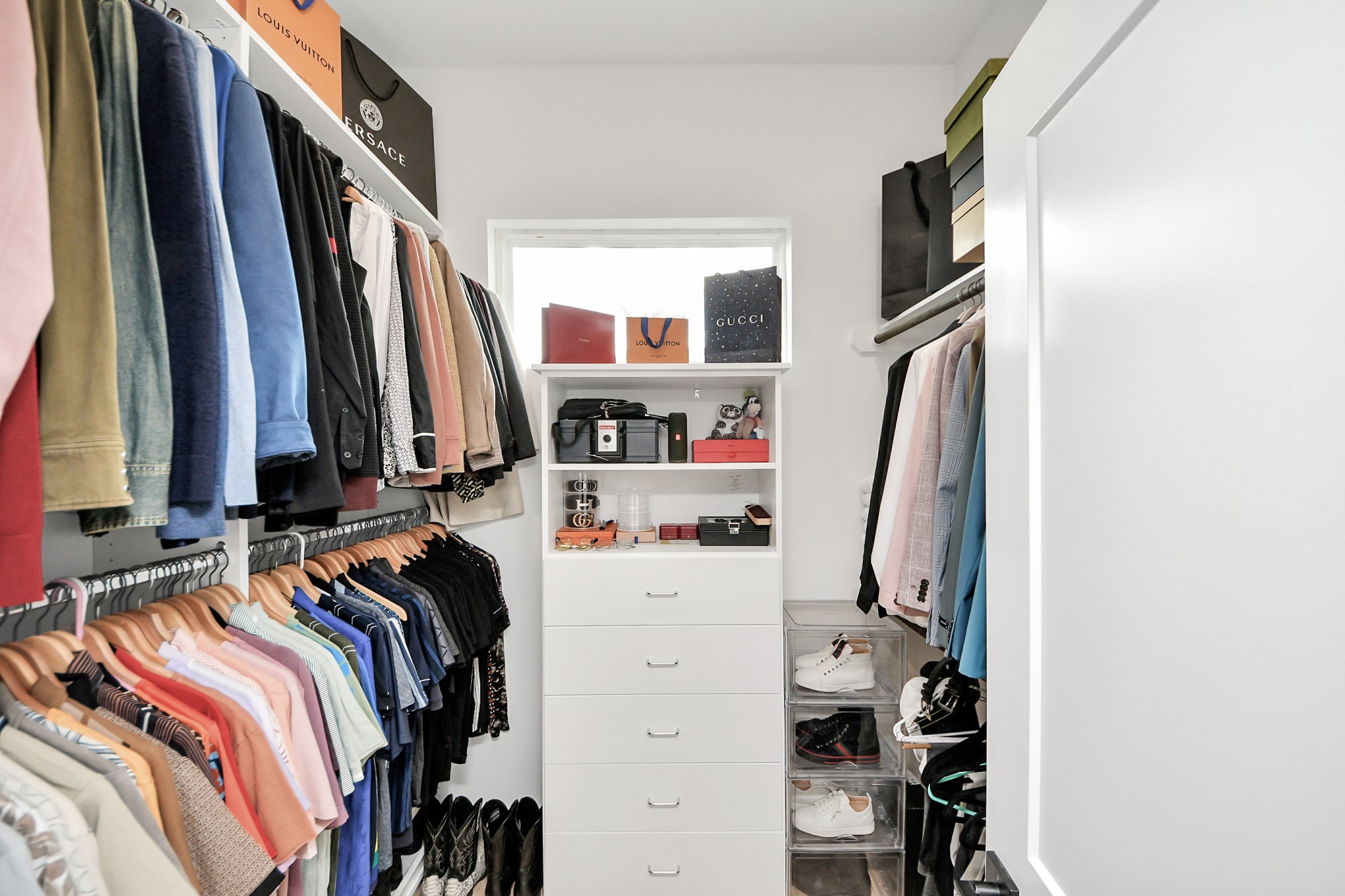 1044 West 17th Street Houston, TX 77008 - Photo 39 of 48 a view of walk in closet with clothes and shoes