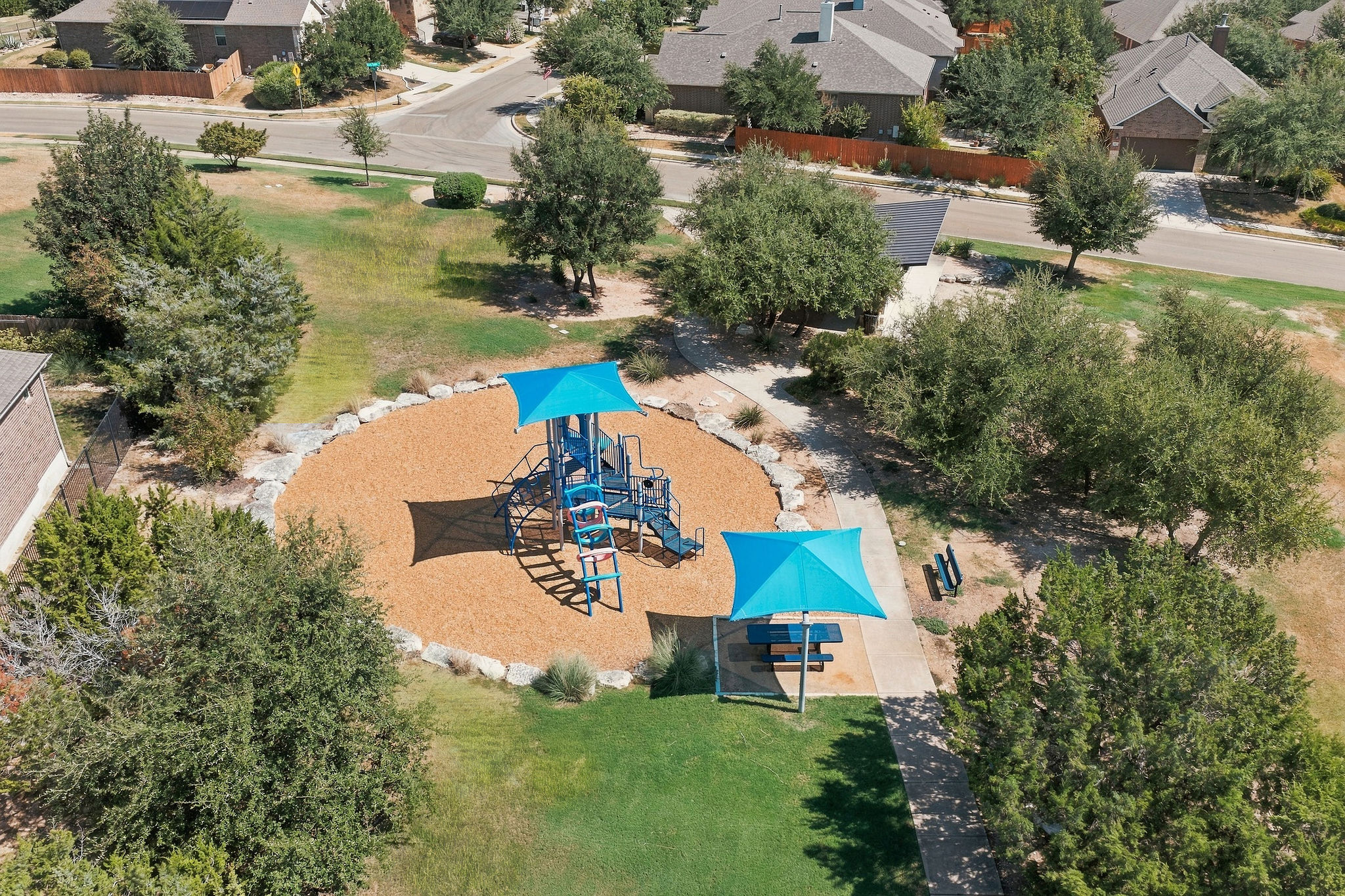 6100 Gunnison Turn Road Austin, TX 78738 - Photo 32 of 34 A well-maintained neighborhood playground is situated within walking distance of the nearby homes.