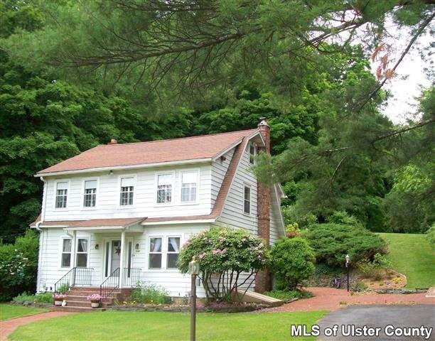 510 Pine Bush Road Stone Ridge, NY 12484 - Photo 1 of 16 a front view of a house with garden