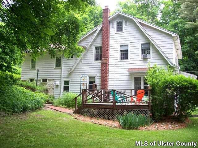 510 Pine Bush Road Stone Ridge, NY 12484 - Photo 13 of 16 a front view of a house with a yard
