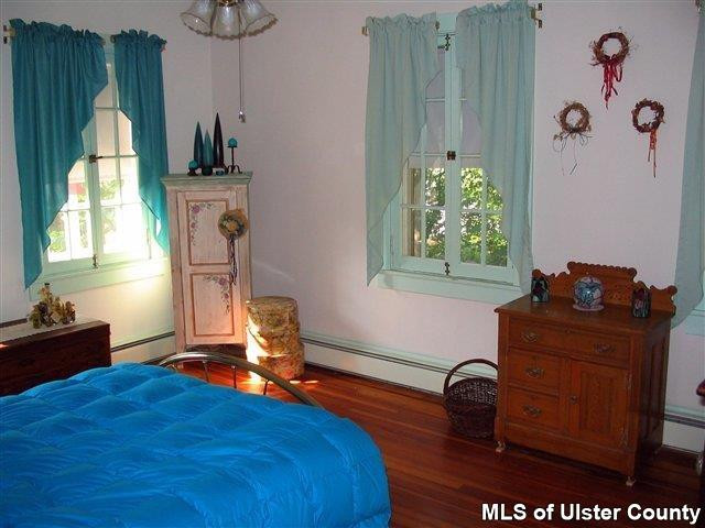 510 Pine Bush Road Stone Ridge, NY 12484 - Photo 7 of 16 a bedroom with furniture and a window