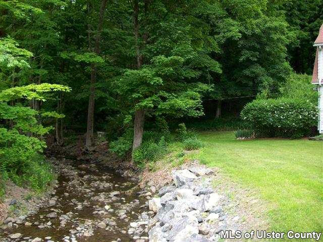 510 Pine Bush Road Stone Ridge, NY 12484 - Photo 9 of 16 a backyard of a house with lots of green space