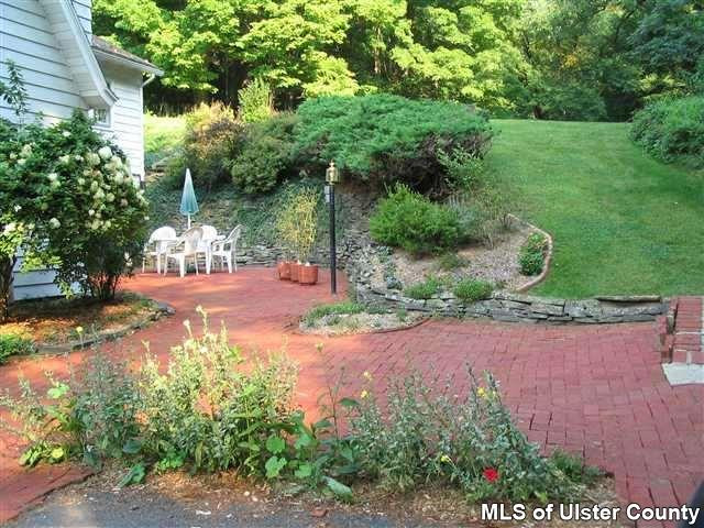 510 Pine Bush Road Stone Ridge, NY 12484 - Photo 10 of 16 a view of a yard with plants and a fountain