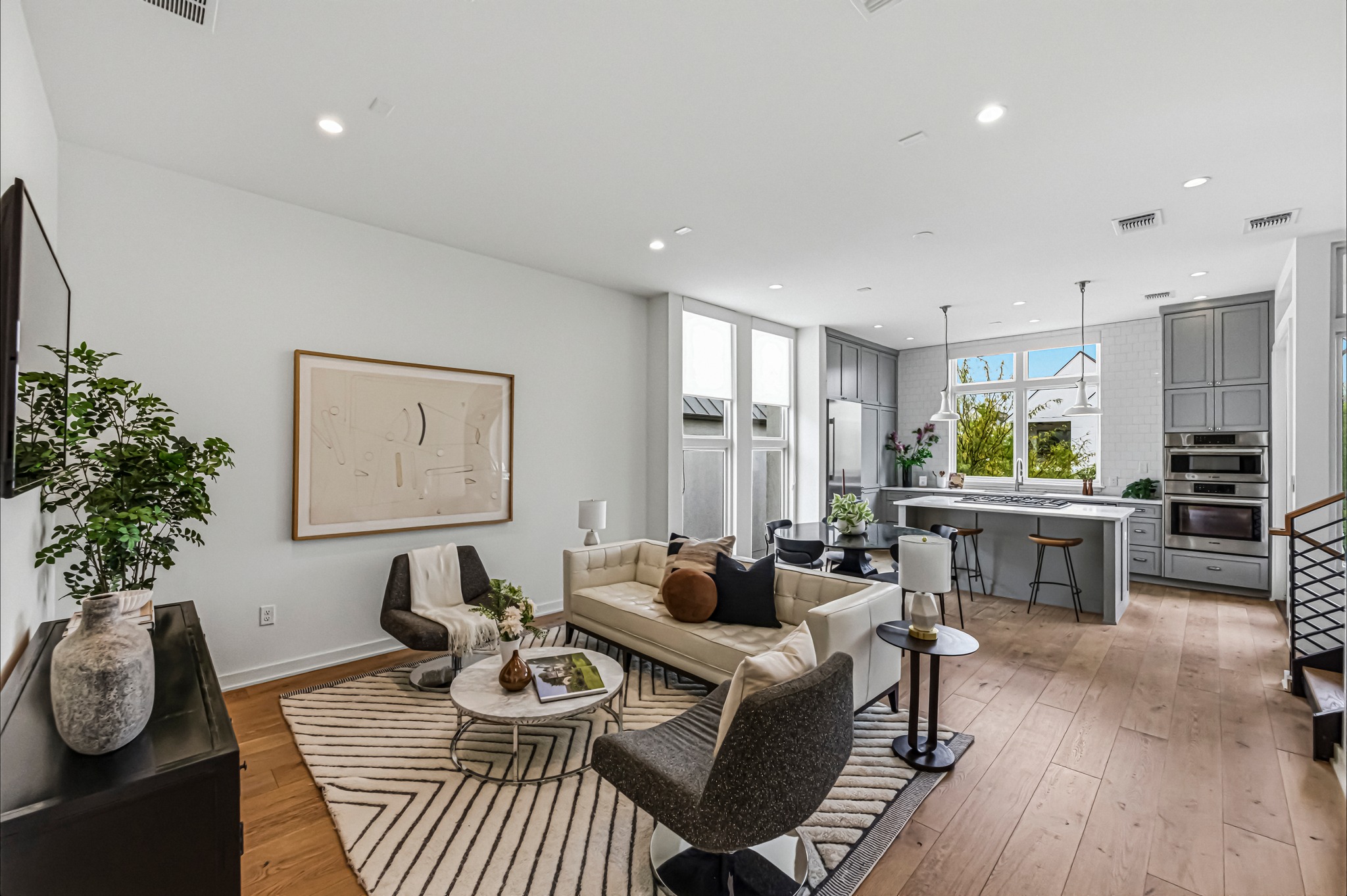 2512 Watkins Way Austin, TX 78746 - Photo 1 of 40 Expansive light-filled living room on the main level is perfect for daily living and entertaining.