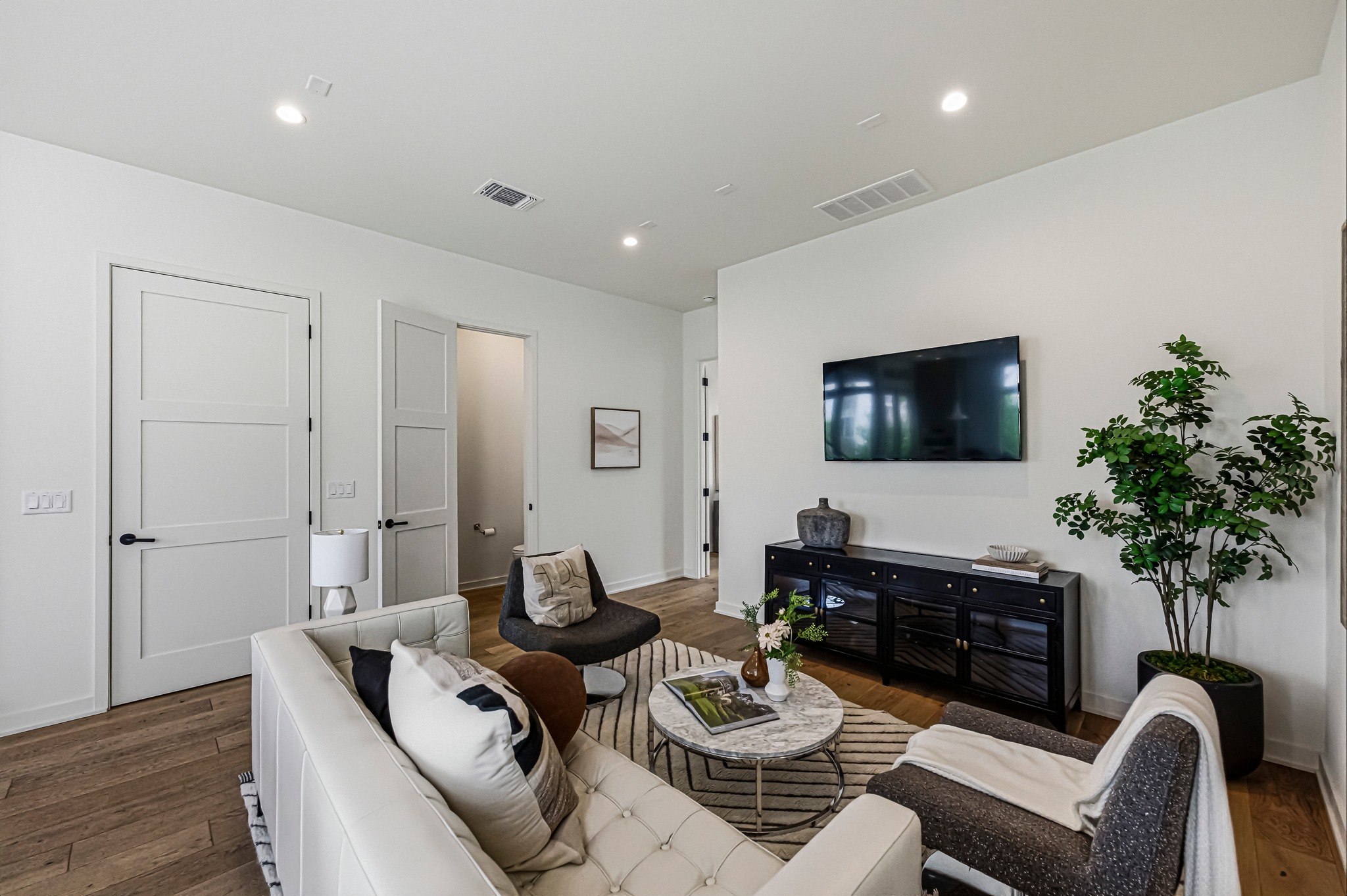 2512 Watkins Way Austin, TX 78746 - Photo 11 of 40 Powder bath just off the living room