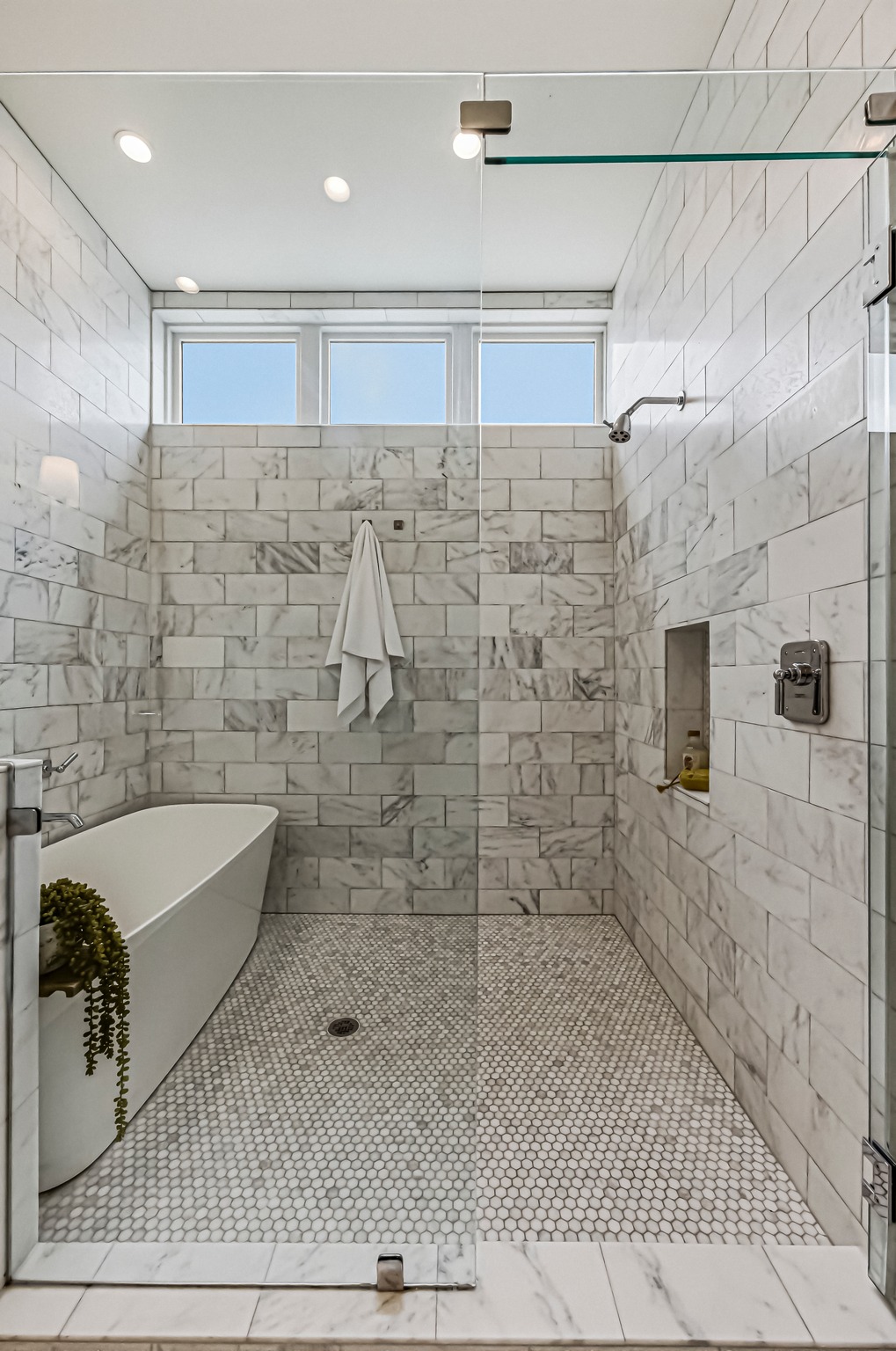 2512 Watkins Way Austin, TX 78746 - Photo 19 of 40 Walk-in shower with designer tile surround