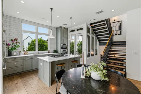 a kitchen with a table and chairs in it