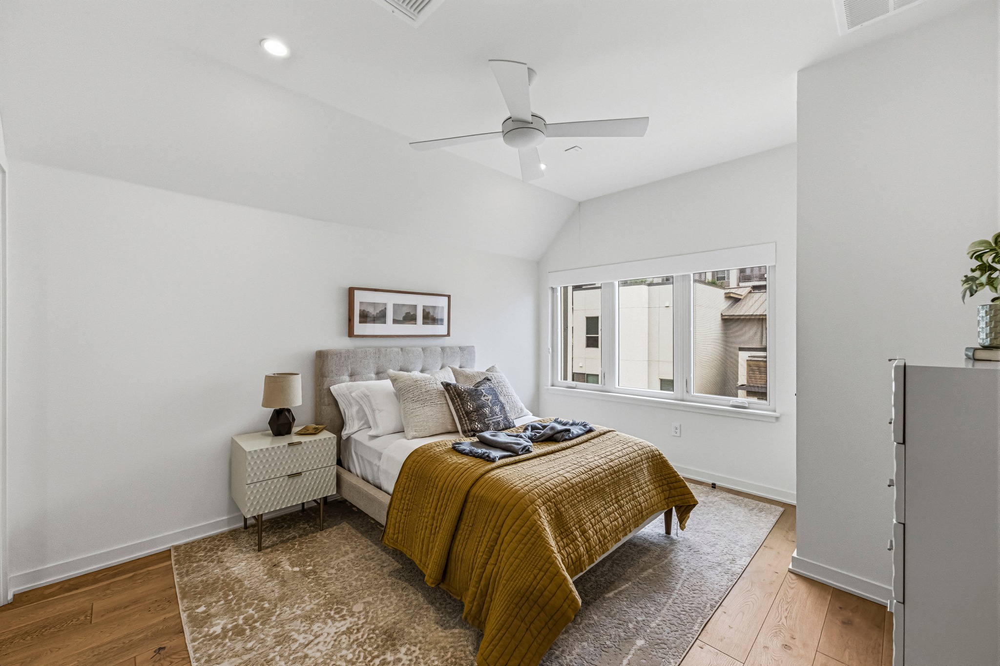 2512 Watkins Way Austin, TX 78746 - Photo 28 of 40 The first of two third-floor bedrooms, both of which are spacous and comfortable
