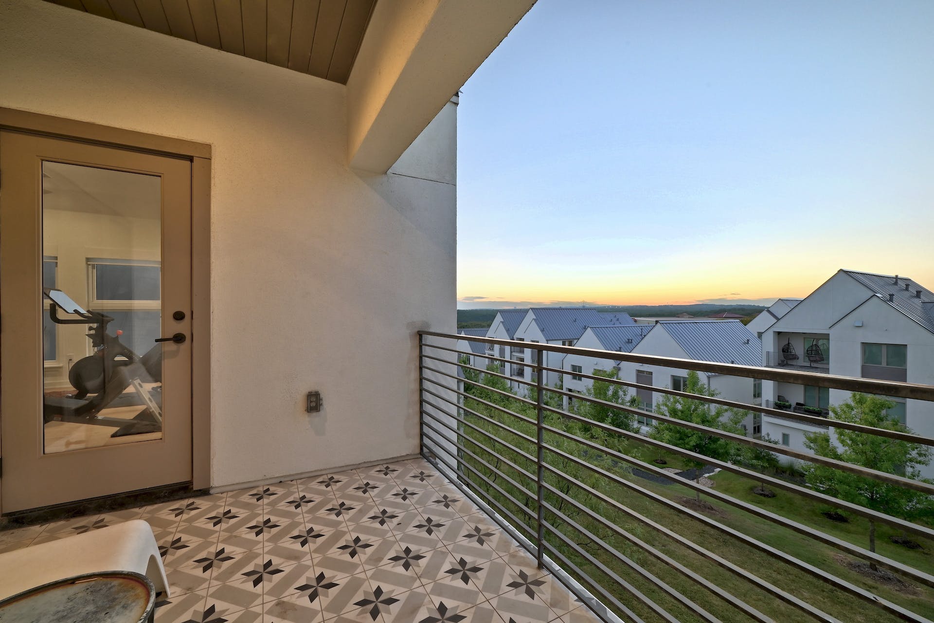 2512 Watkins Way Austin, TX 78746 - Photo 38 of 40 Relax on the second-floor balcony to sunset views.