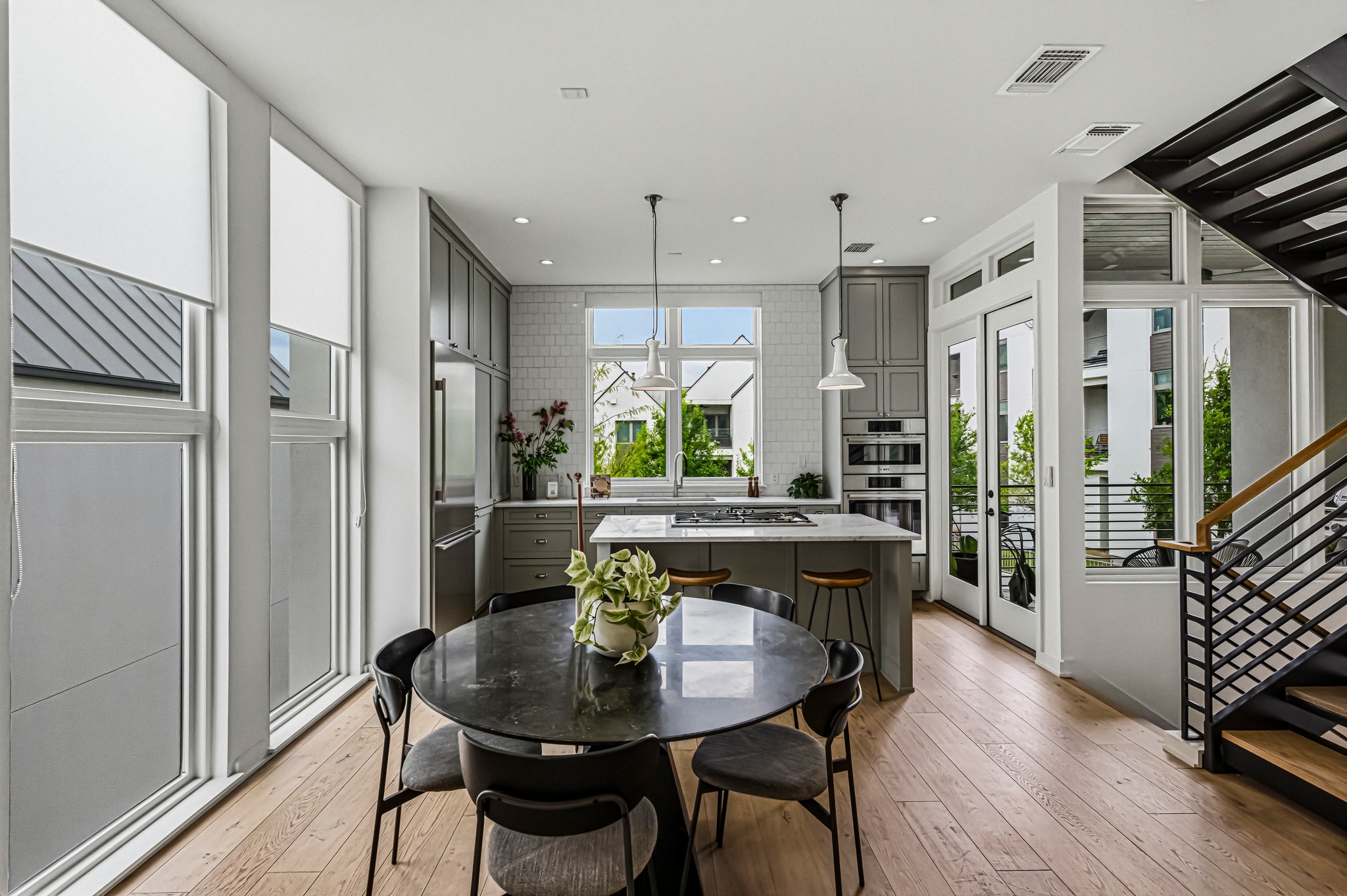 2512 Watkins Way Austin, TX 78746 - Photo 4 of 40 Bright dining space with room for gatherings with extra space for stools at the bar