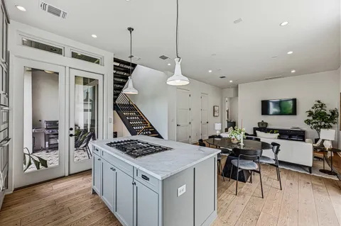 a kitchen that has a table and chairs in it
