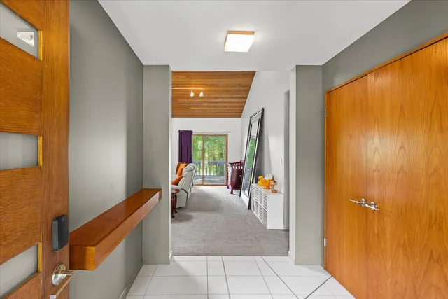 a kitchen with a table chairs and a refrigerator