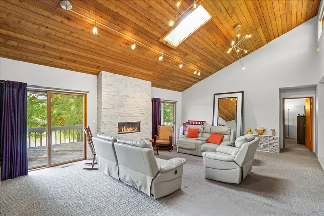 a living room with furniture fireplace and a flat screen tv