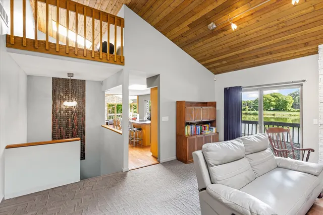 a living room with fireplace furniture and a flat screen tv