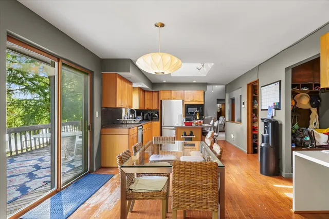 a kitchen with stainless steel appliances granite countertop a sink and a stove
