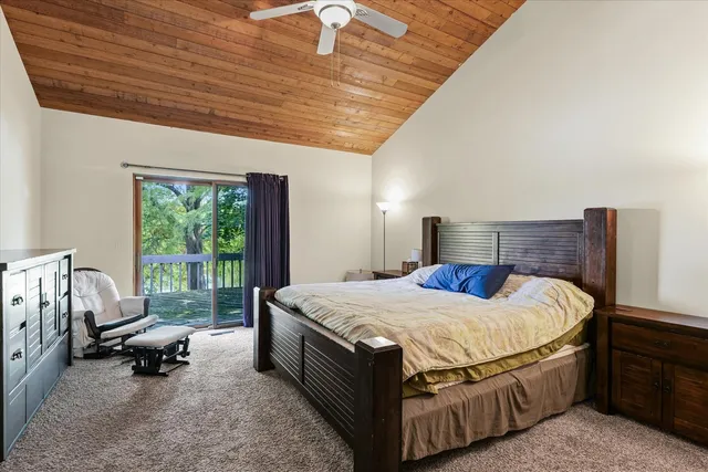 a bathroom with a sink a toilet and shower curtain