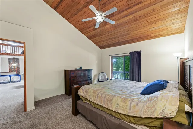 an aerial view of a house with a yard and garden