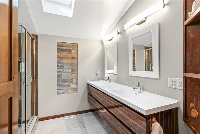 a view of a lake with houses in the back