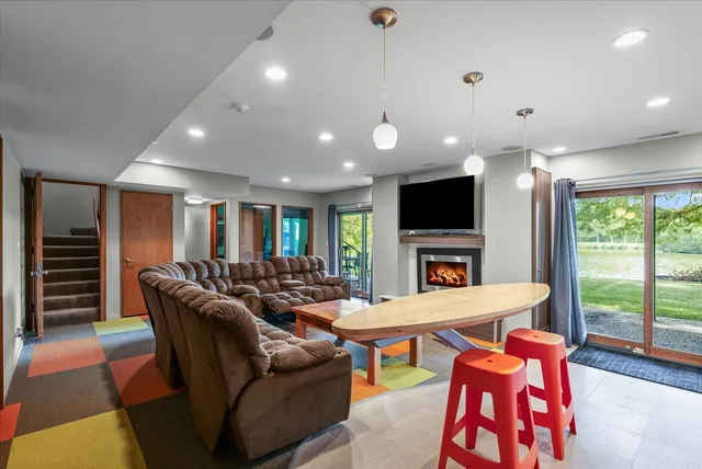a view of a big house with a big yard and large trees