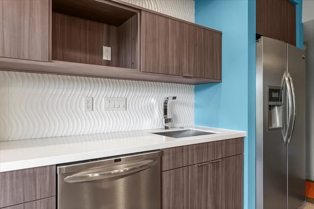 a view of a lake with houses in the back