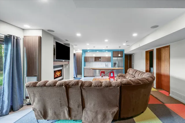 an aerial view of a house with a yard and lake view