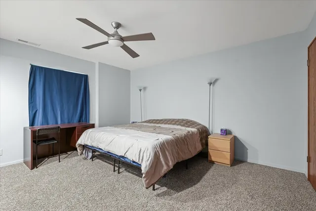 an aerial view of a residential houses with outdoor space and lake view