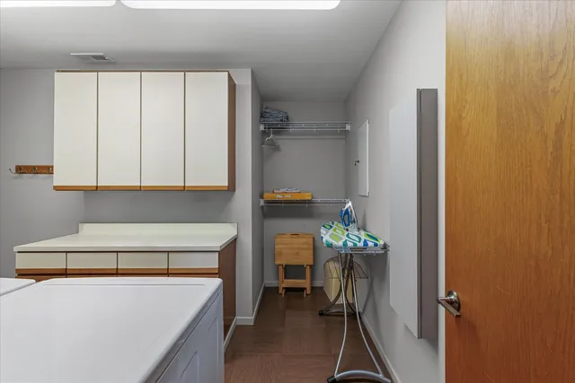 an aerial view of a swimming pool patio and outdoor seating