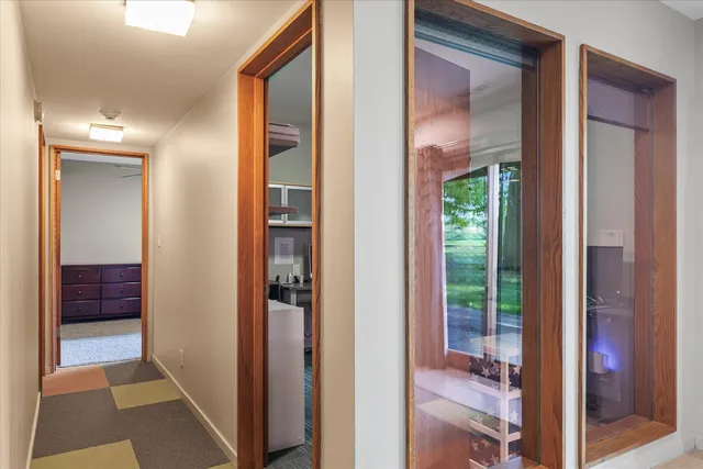 a picture of a bench in front of a wall