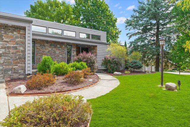 a living room with furniture a rug and a window