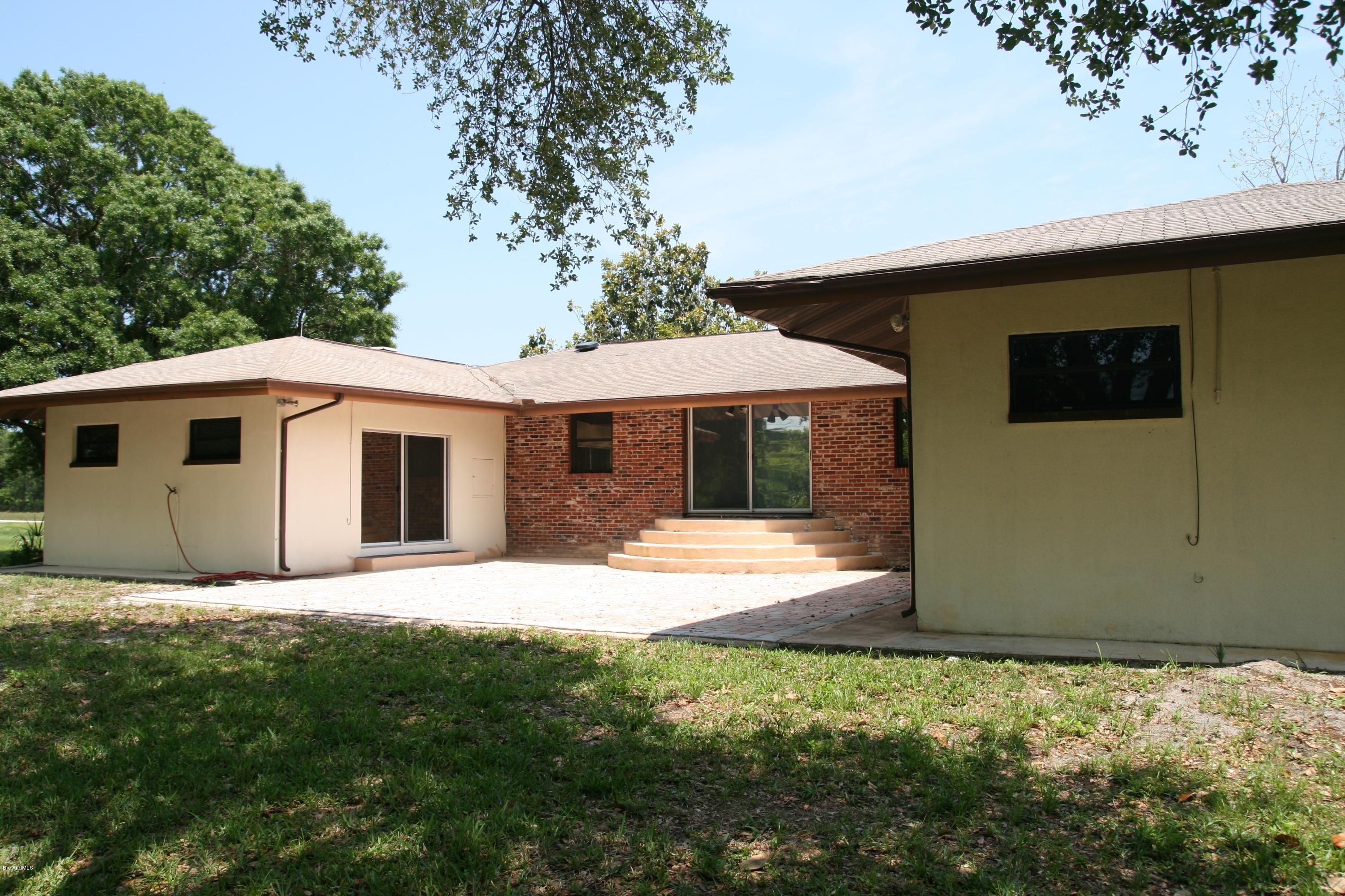 4303 Rayburn Road Cocoa, FL 32926 - Photo 4 of 26 rear of home and paver patio