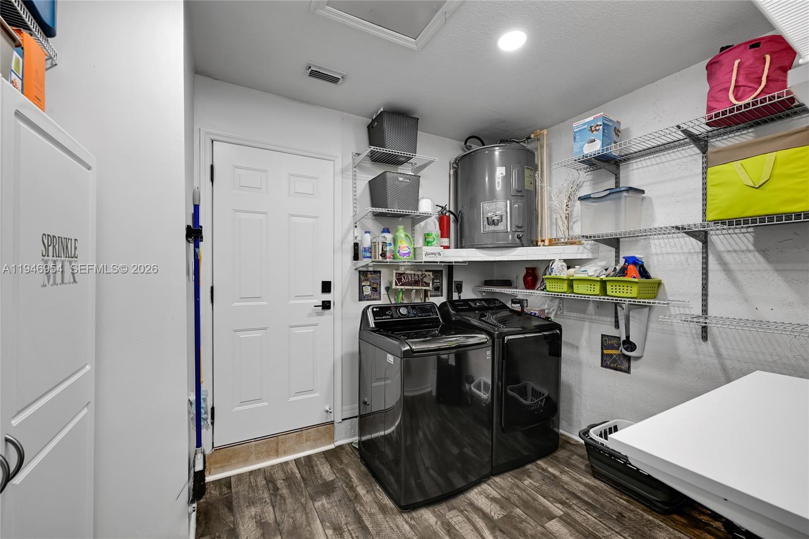 24955 Southwest 129th Path Homestead, FL 33032 - Photo 21 of 26 a kitchen with stainless steel appliances granite countertop a stove and a refrigerator