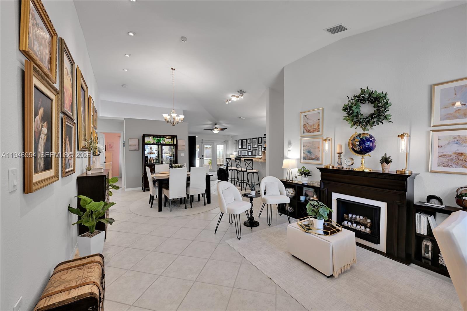 24955 Southwest 129th Path Homestead, FL 33032 - Photo 3 of 26 a living room with furniture and a fireplace