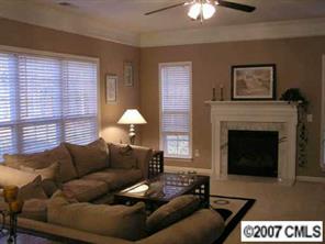 4118 Desert Rose Court Fort Mill, SC 29708 - Photo 3 of 8 a living room with furniture and a fireplace