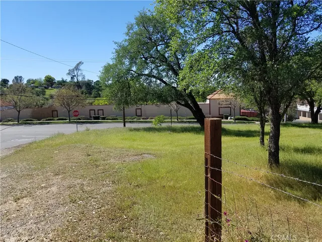 a swimming pool with trees in the background