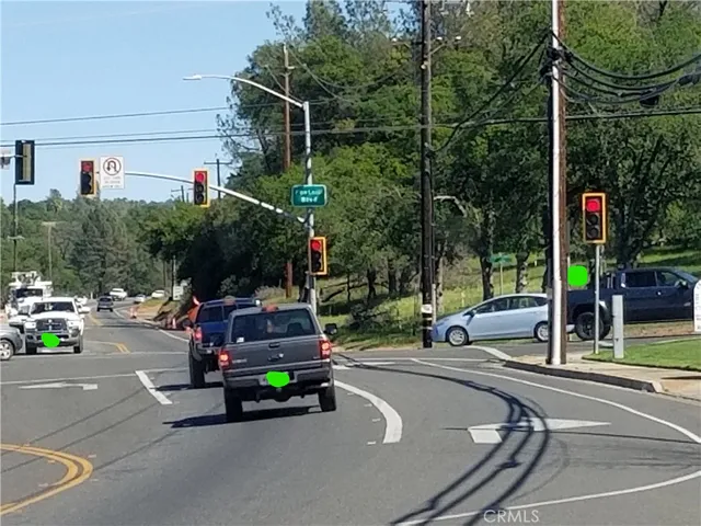 a view of a patio with a table and chairs