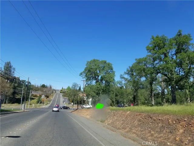 a view of a road with a building in the background