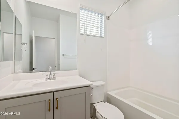 a bathroom with a sink toilet and bathtub