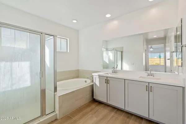 a bathroom with a bathtub and a sink