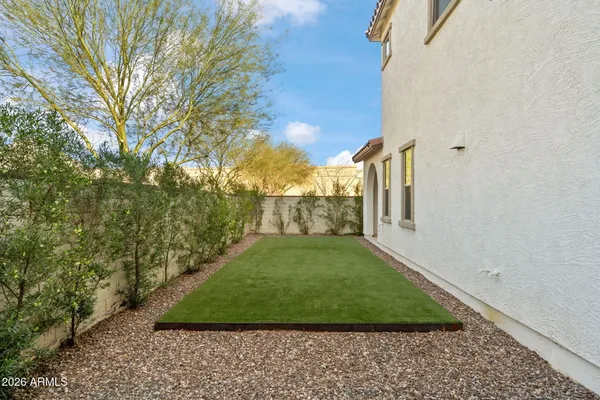 a view of a house with a small yard